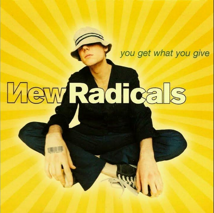 Album cover of man sitting cross-legged on yellow background